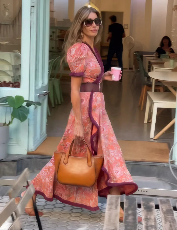 VESTIDO LARGO ELEGANTE CON MANGAS CORTAS ABULLONADAS Y FALDA ASIMÉTRICA